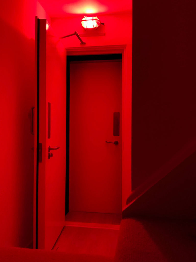 Basement recording studio soundproof double doors with red on air recording light