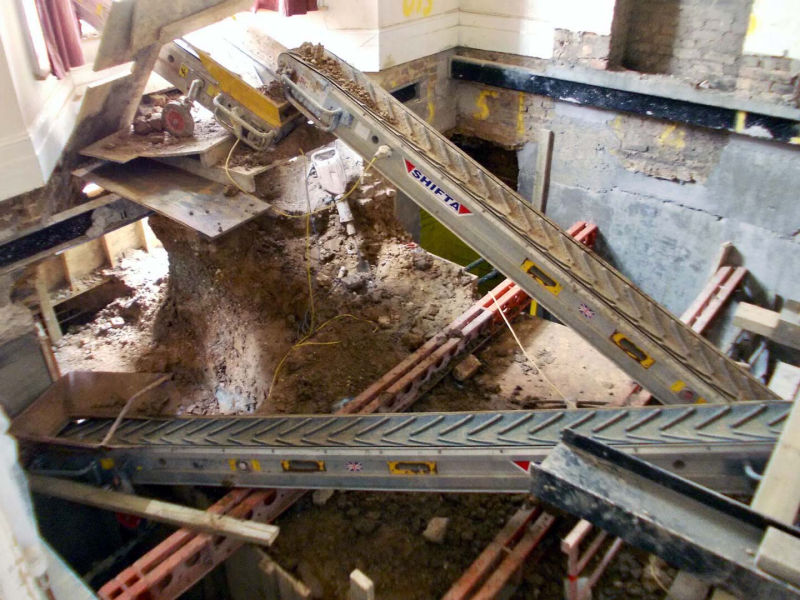 conveyor belts excavating basement under Victorian house